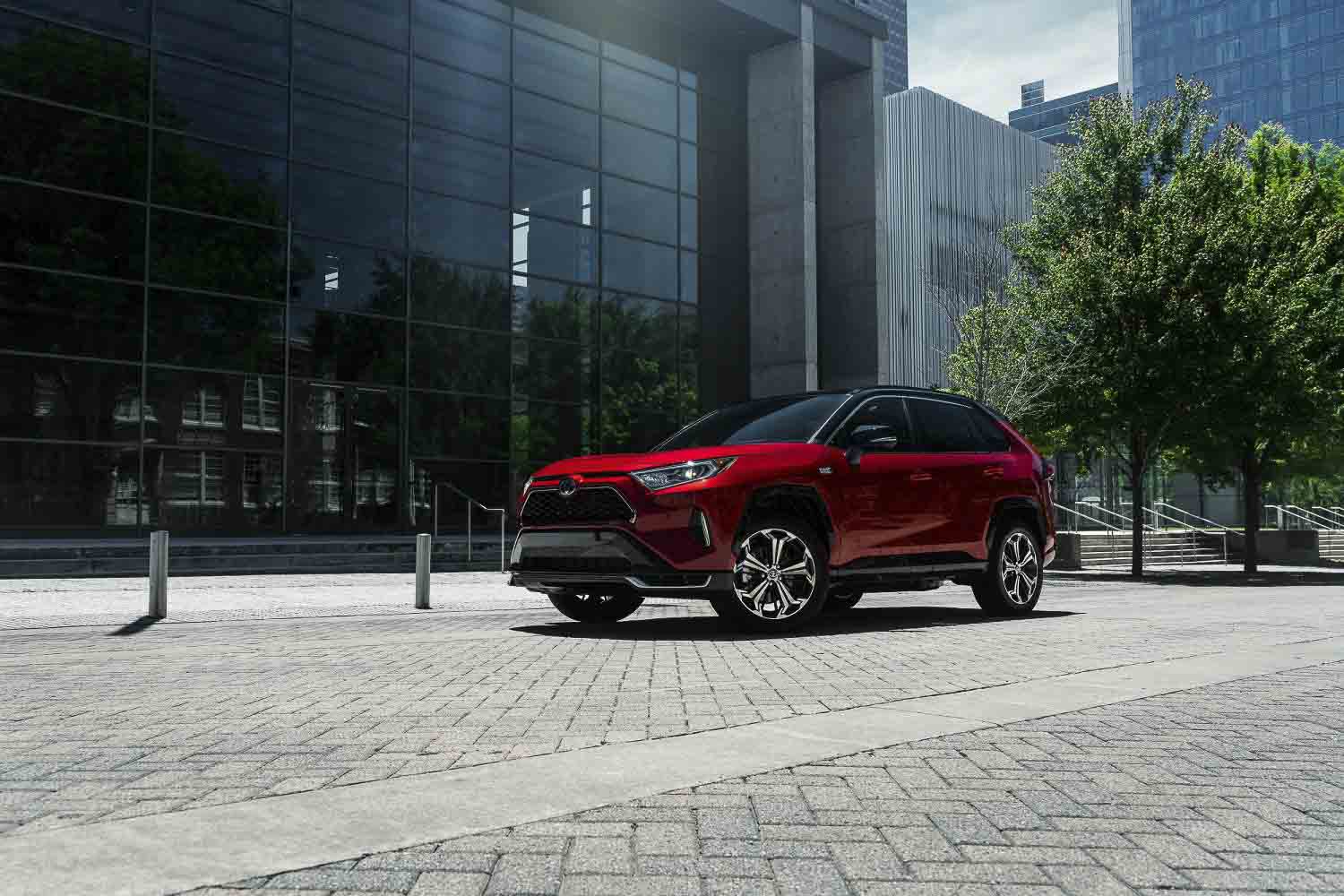 three quarter front view of the 2021 Toyota RAV4 parked in the city
