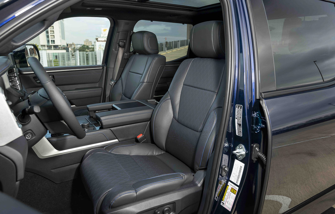 view of the front row seats and steering wheel inside of the 2022 Toyota Tundra