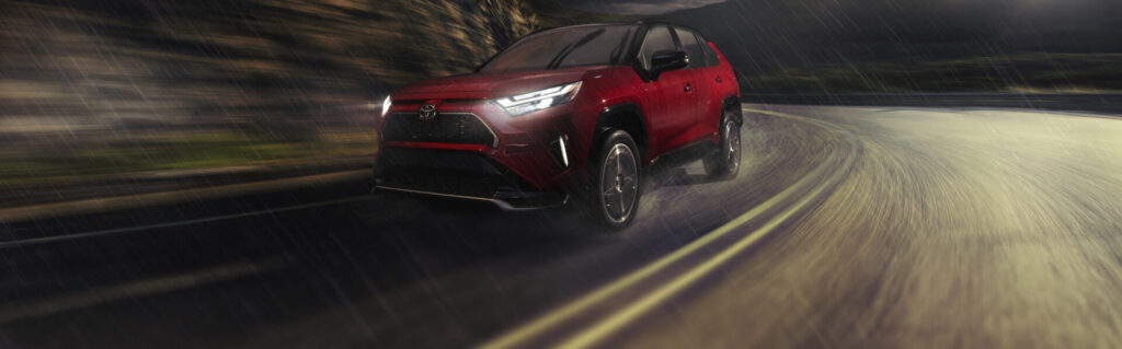 RAV4 Plug in Hybrid XSE AWD shown in Supersonic Red with Black Roof  1024x319
